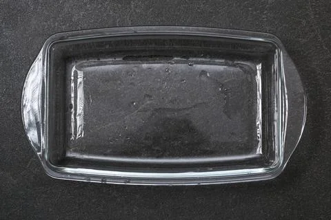 A baking dish cleaned from thick layer of carbon. Glassware for baking after Stock Photos