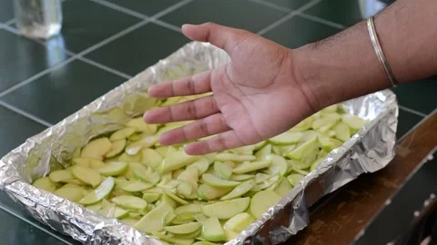 Baking Dish filled with Apple Wedges Stock Footage 130356249