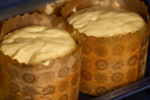 Baking Easter cakes in the oven, raw dough. Stock Photos