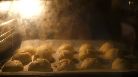 Baking Eclair in Oven Tray. Made of Choux Dough filled with Vanilla cream. Close Vídeos de archivo 129305770