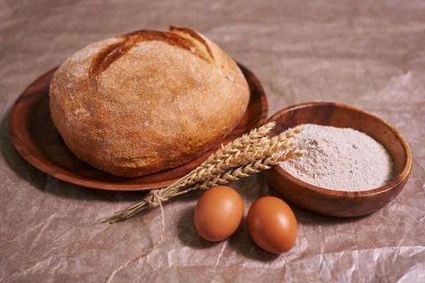 Baking egg and bread in rustic kitchen Stock Photos