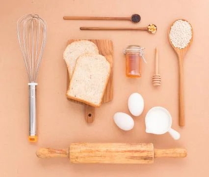 Baking Equipment make Bread wheat grains and cereals on wooden background Stock Photos