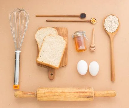 Baking Equipment make Bread wheat grains and cereals on wooden background Photos