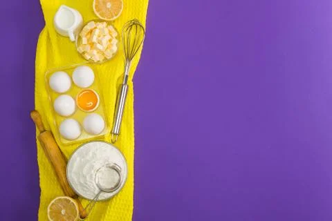 Baking flat lay composition with eggs floor butter lemon milk Stock Photos