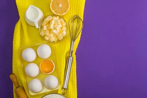 Baking flat lay composition with eggs butter lemon milk Stock Photos