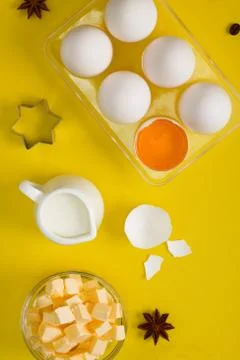 Baking flat lay with eggs butter milk spices cookie cutter Stock Photos