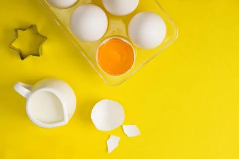 Baking flat lay with eggs milk spices cookie cutter Stock Photos