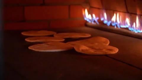 Baking Flatbreads in a Traditional Oven Stock Footage 318310110