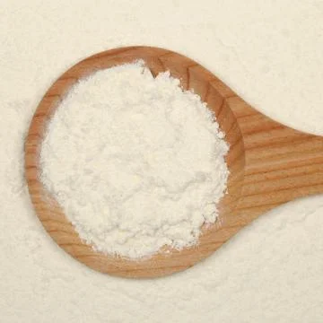 Baking: flour on a spoon Stock Photos