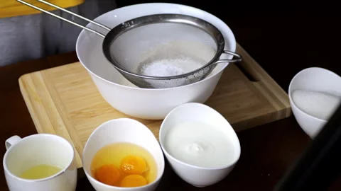 Baking a fragrant cake from flour, eggs, sugar, sour cream2 Stock Footage 291333615