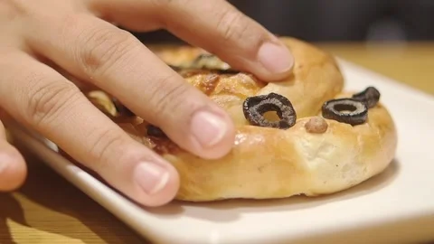 Baking fresh bread with olives on top in a cozy bakery 스톡 동영상 341732760