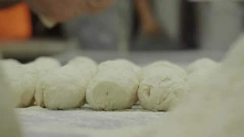 Baking fresh bread rolls in a busy kitchen Stock Footage 315335781