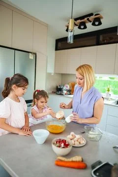 Baking fun in the kitchen with kids and parent Stock Photos