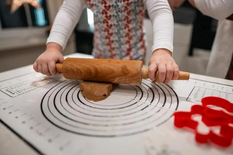 Baking Fun Rolling Out Dough with Cookie Cutters in a Cozy and Inviting Kitchen Stock Photos