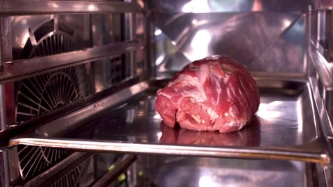 Baking ham in the oven Stock Footage 119300657