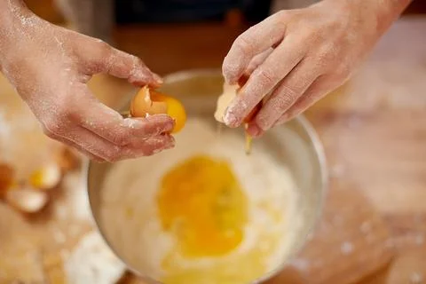 Baking, hands and egg in kitchen for culinary skills, hobby and bread dough.. Stock Photos
