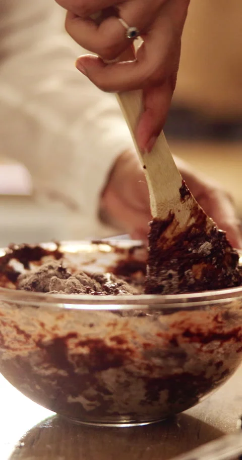 Baking, hands and mixing ingredients in house for chocolate cake, recipe process Stock Footage 339047611