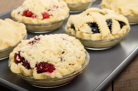 Baking homemade fresh fruit pies 写真素材