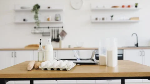 Baking ingredients and tools set up in a modern kitchen Stock Footage 305474027