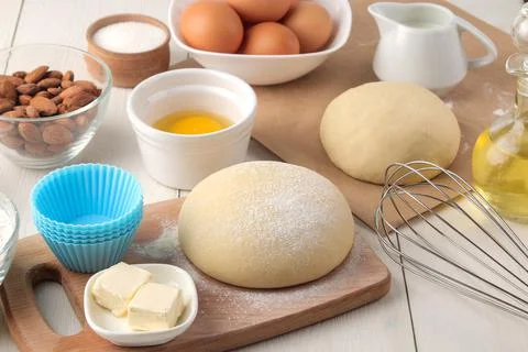 Baking ingredients. baking tools. dough and butter, eggs, sugar, milk, cinnam Stock Photos