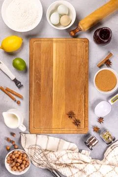 Baking ingredients with cutting board and spices Stock Photos