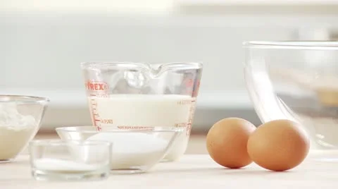 Baking ingredients: eggs, salt, sugar, flour, milk Video stock 24635166