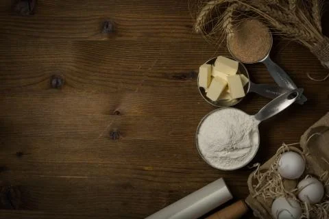 Baking ingredients in measuring cups Stock Photos