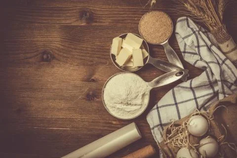 Baking ingredients in measuring cups Stock Photos