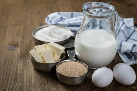 Baking ingredients in measuring cups Stock Photos