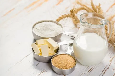 Baking ingredients in measuring cups Stock Photos