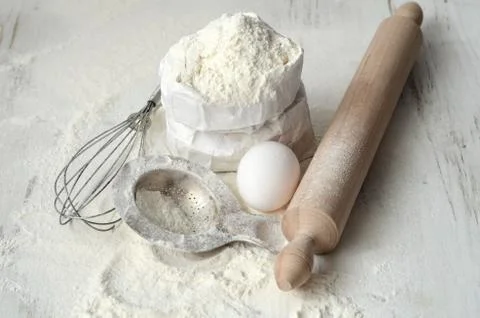 Baking ingredients on a table Stock Photos