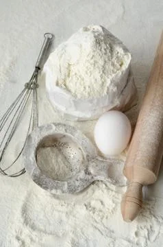 Baking ingredients on a table Stock Photos
