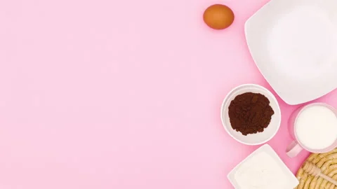 Baking items and cookies in plate appear on right side. Stop motion Stock Footage 138713629