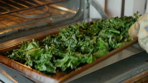 Baking kale chips Stock Footage 132681003