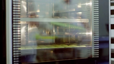 Baking macarons in a professional oven Stock Footage 72326541