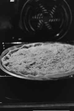 Baking making pizza with cheese in an electric oven Stock Photos