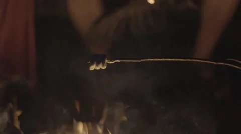 Baking Marshmallow over the campfire Stock Footage 68906809