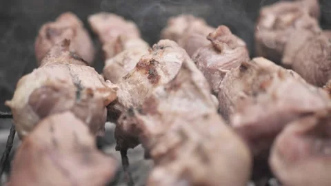 Baking meat in a barbecue. meat is cooked in hot air, close-up view Stock Footage 133194348