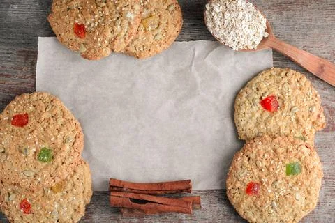 Baking, oat biscuits in a flatlay with a wooden spoon and cinnamon sticks o.. Stock Photos