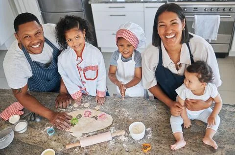 Baking is an opportunity to develop new skills. a couple baking at home with Stock Photos
