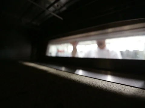 Baking in the oven - Chef verifies the oven Video stock 79975600