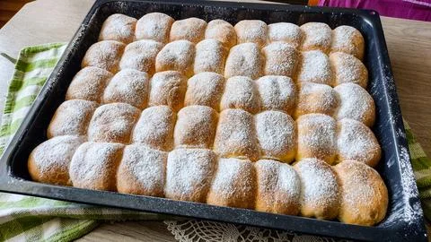Baking pan with buns Stock Photos