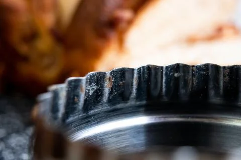Baking pan with flour and bread residues on a table and a pan behind. Stock Photos