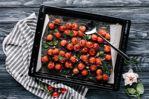 Baking pan red cherry tomatoes Stock Photos