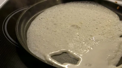 Baking Pancakes On A Frying Pan On Kitchen Stove. Stock Footage 104045890