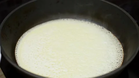Baking pancakes in a pan, close-up Stock Footage 194566068