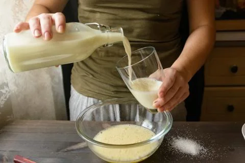 Baking pancakes in rural kitchen Stock Photos