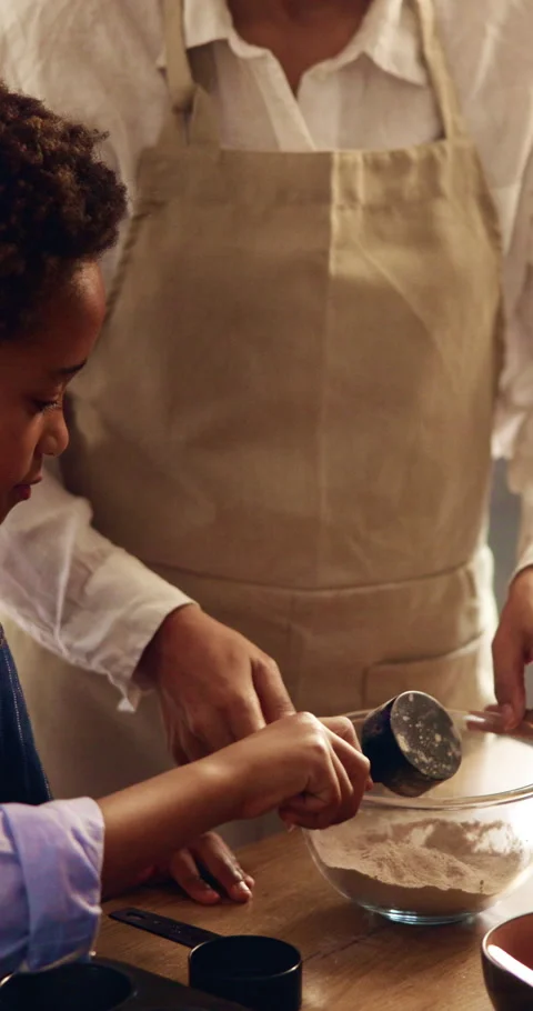 Baking, parent and child with flour in mixing bowl for cake process, teaching Stock Footage 339048225