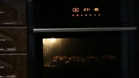 Baking pies in a flame cupboard 1 Stock Footage 83455387