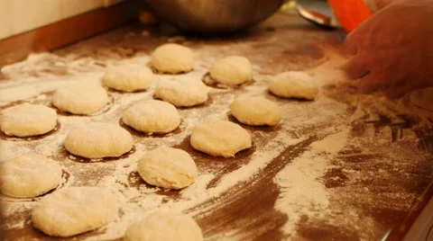 Baking pies in home kitchen. Cutting out circles from raw dough Video stock 61416440